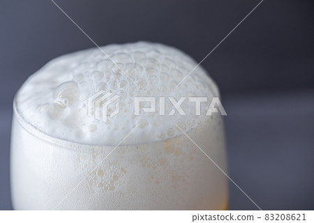Beer that shines on a gray background 83208621