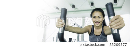 Portrait of beautiful smile healthy asian tan woman running on treadmill. People beauty perfect body slim, young asian fitness girl at gym sport club. Freedom happy relax lifestyle healthcare banner 83209377