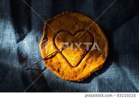 Brown sugar caramel candy cookies with a metal needle Brown sugar caramel candy cookies with a metal needle 83210218