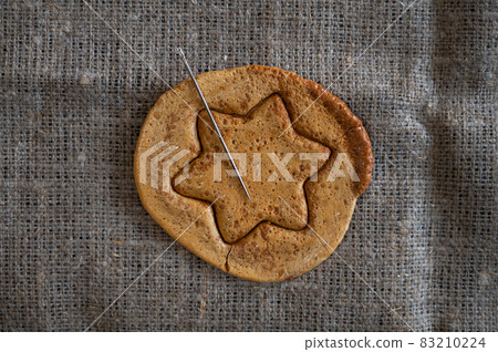 Brown sugar caramel candy cookies with a metal needle Brown sugar caramel candy cookies with a metal needle 83210224