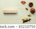 Five wooden cubes are lined up side by side with images of pine cones and autumn. 83210750