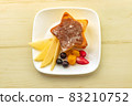 Image of star-shaped pancakes and fruits arranged side by side in the center 83210752