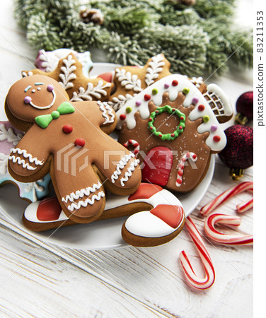Christmas gingerbread in the plate on white. Top view. Christmas gingerbread in the plate on white. Top view. 83211353
