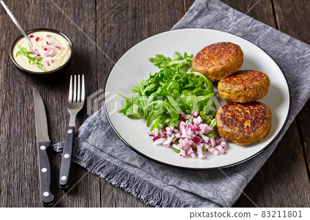 vegan lentil patties with rocket onion salad vegan lentil patties with rocket onion salad 83211801