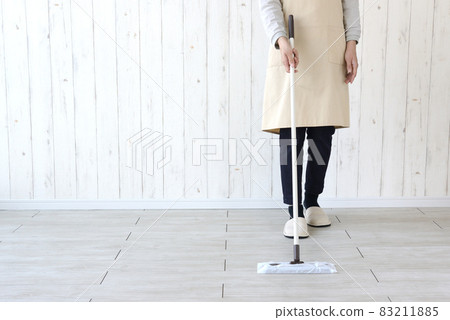 Housewife wiping the floor 83211885