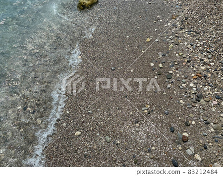Wet colourful pebbles on the beach Wet colourful pebbles on the beach 83212484