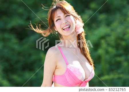 Bikini woman laughing happily Bikini woman laughing happily 83212765