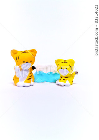 Tiger figurine on white background 83214023