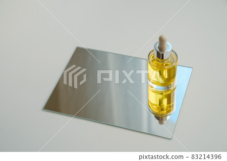 Yellow face oil on mirror 83214396