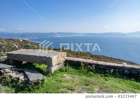 Stone bench at the viewpoint between Marmeelan and Crohy Head, Dungloe - County Donegal - Ireland. Stone bench at the viewpoint between Marmeelan and Crohy Head, Dungloe - County Donegal - Ireland. 83215467