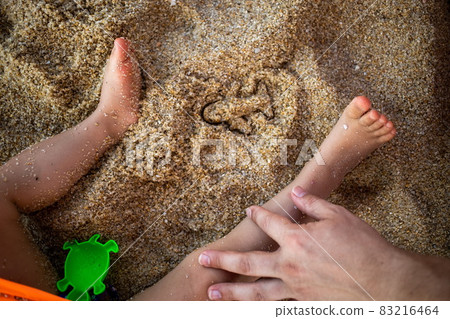 concept of opening flights between countries, end quarantine of the pandemic world planet. vacation abroad. trace from the sandbox mold in the form of an airplane on the sand of a beach next to concept of opening flights between countries, end quarantine of the pandemic world planet. vacation abroad. trace from the sandbox mold in the form of an airplane on the sand of a beach next to 83216464