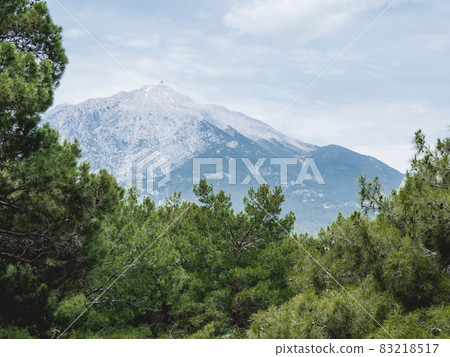 Mountain Tahtali Dagi, also known as Lycian Olympus among forests. Spring landscape. Turkey. Mountain Tahtali Dagi, also known as Lycian Olympus among forests. Spring landscape. Turkey. 83218517