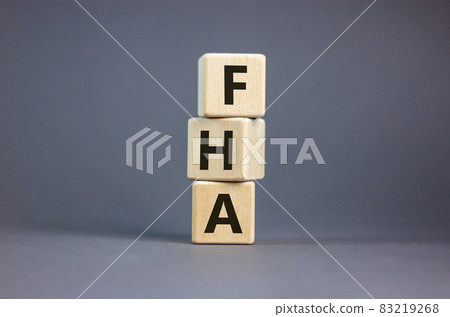 FHA symbol. Wooden cubes form the word 'FHA, federal housing administration'. Beautiful grey background, copy space. Business and FHA concept. FHA symbol. Wooden cubes form the word 'FHA, federal housing administration'. Beautiful grey background, copy space. Business and FHA concept. 83219268