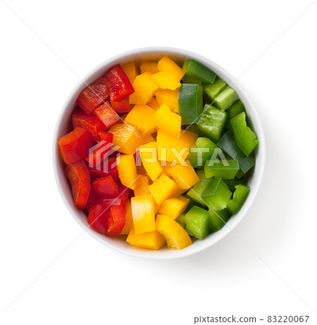 Cut Pepper Pieces In White Bowl Isolated Cut Pepper Pieces In White Bowl Isolated 83220067