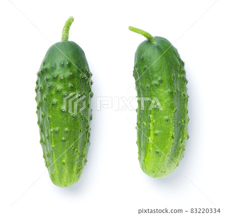 Two Fresh Green Cucumbers Isolated On White Two Fresh Green Cucumbers Isolated On White 83220334