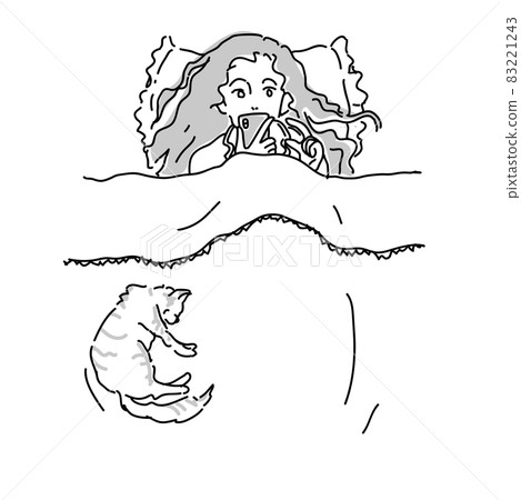 A woman enjoying a smartphone in bed A woman enjoying a smartphone in bed 83221243