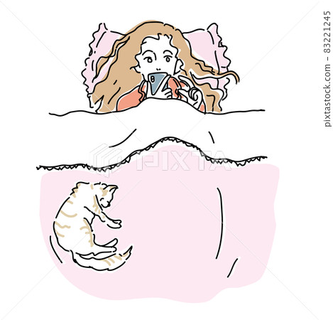 A woman enjoying a smartphone in bed 83221245