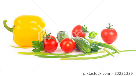 Vegetables on the white background - broccoli, tomatoes, cucumbers and green onions. Composition of vegetables on the white background Vegetables on the white background - broccoli, tomatoes, cucumbers and green onions. Composition of vegetables on the white background 83221389