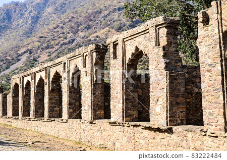 Stone wall with arches Stone wall with arches 83222484