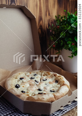 Close-up of pizza with shrimps. Seafood and vegetarian food. Italian food in restaurants and cafes. The concept of marine ingredients in meal preparation. Close-up of pizza with shrimps. Seafood and vegetarian food. Italian food in restaurants and cafes. The concept of marine ingredients in meal preparation. 83222604