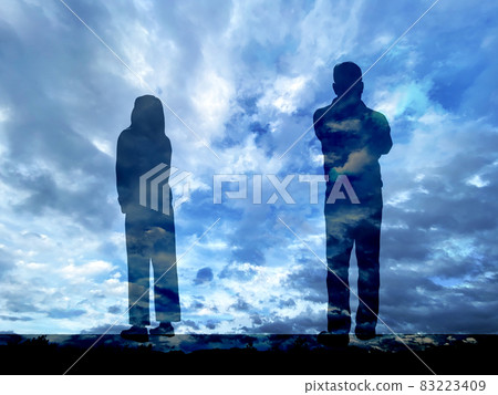 Silhouettes of men and women facing each other _ storm background 83223409