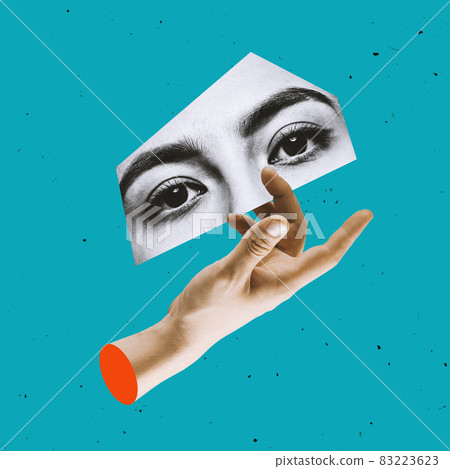 Contemporary art collage of human hand and piece of black and whie part of female face, eyes isolated over blue background 83223623
