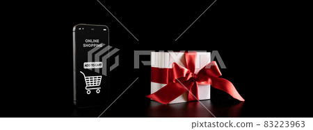 Discount background. Black Friday banner with internet online shopping app on mobile phone, white gifts with red bow falling on black. Internet shopping experience. E commerce concept. Discount background. Black Friday banner with internet online shopping app on mobile phone, white gifts with red bow falling on black. Internet shopping experience. E commerce concept. 83223963