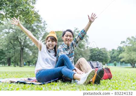 Couple enjoying a picnic Couple enjoying a picnic 83224132