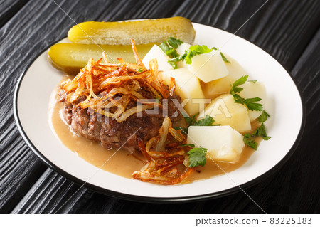 Tasty Danish Beef Patties Bof with gravy and Soft Onions with potatoes garnish close up in the plate. Horizontal Tasty Danish Beef Patties Bof with gravy and Soft Onions with potatoes garnish close up in the plate. Horizontal 83225183