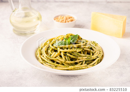 Pasta spaghetti with pesto sauce and fresh basil leaves Pasta spaghetti with pesto sauce and fresh basil leaves 83225510