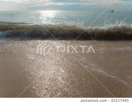 Splash of Sea wave on sand Splash of Sea wave on sand 83227405