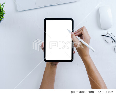 hand using stylus pen on digital tablet hand using stylus pen on digital tablet 83227406