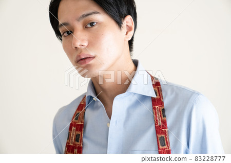 A man getting dressed A man getting dressed 83228777