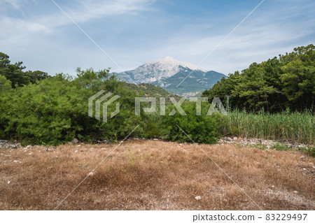 Mountain Tahtali Dagi, also known as Lycian Olympus among forests. Spring landscape. Turkey. 83229497