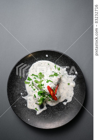 traditional georgian food gebjalia with matsoni cheese and red chili pepper 83232716