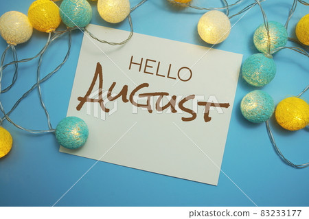 Hello August typography text with LED cotton ball on blue background 83233177