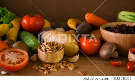 vegetables, seeds, nuts, rice berry, fruits on wooden table. vegan, plant-based, organic. vegetables, seeds, nuts, rice berry, fruits on wooden table. vegan, plant-based, organic. 83236165