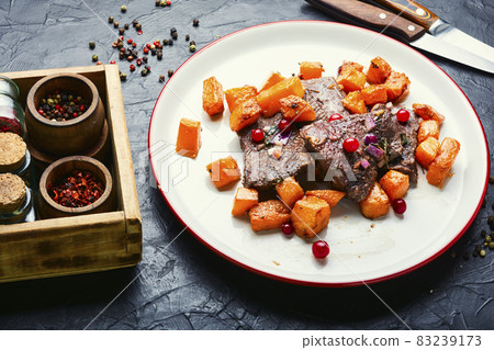 Veal meat with vegetables Veal meat with vegetables 83239173