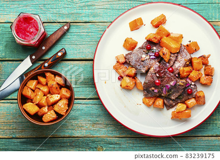 Roasted beef with pumpkin Roasted beef with pumpkin 83239175