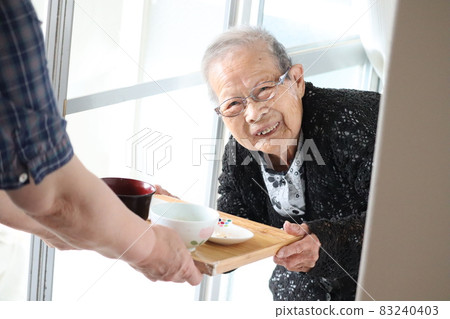 A person who cares for grandma, a person who smiles 83240403