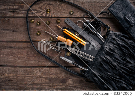 Leather crafting. Tools flat lay still life Leather crafting. Tools flat lay still life 83242000
