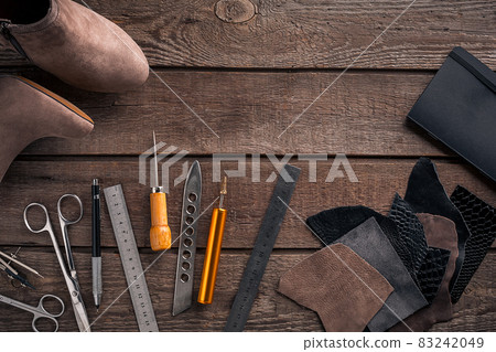 Leather crafting. Tools flat lay still life Leather crafting. Tools flat lay still life 83242049