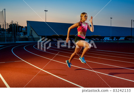 Runner sprinting towards success on run path running athletic track. Goal achievement concept. 83242133