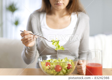 Woman dieting and eating a salad 83242366