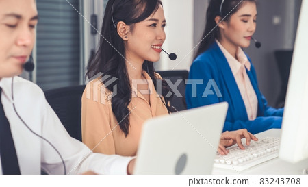 Business people wearing headset working actively in office 83243708