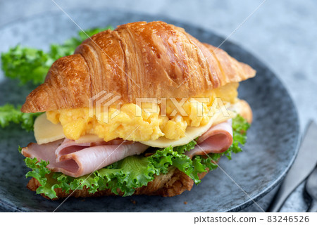 Croissant sandwich with egg and ham Croissant sandwich with egg and ham 83246526