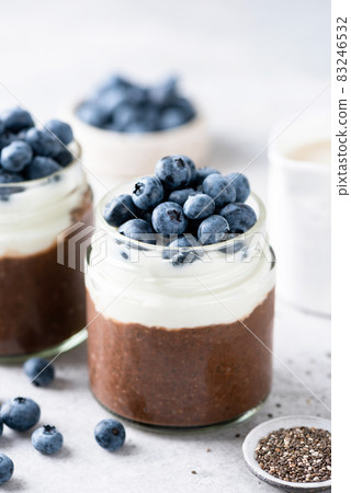 Chocolate chia seed pudding with yogurt and blueberries Chocolate chia seed pudding with yogurt and blueberries 83246532