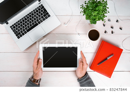Directly above view of human hands typing on laptop. Directly above view of human hands typing on laptop. 83247844