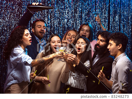 Joyful young friends hanging out together at club, having party Joyful young friends hanging out together at club, having party 83248273