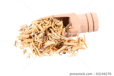 Muira Puama herbal tea in wooden scoop, isolated on white background. Natural potency wood, medicinal plant, dry tea. Ptychopetalum olacoides. 83249270